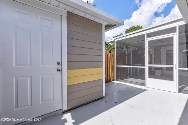 entrance to property with a patio area