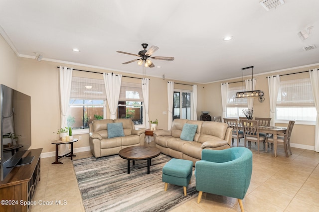 tiled living room with ceiling fan and ornamental molding