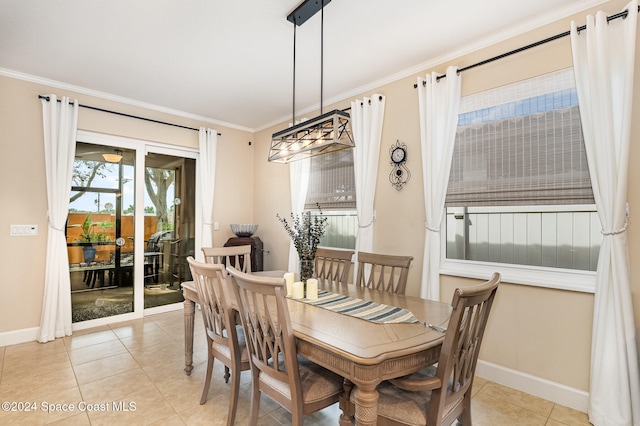 tiled dining space featuring a notable chandelier and crown molding