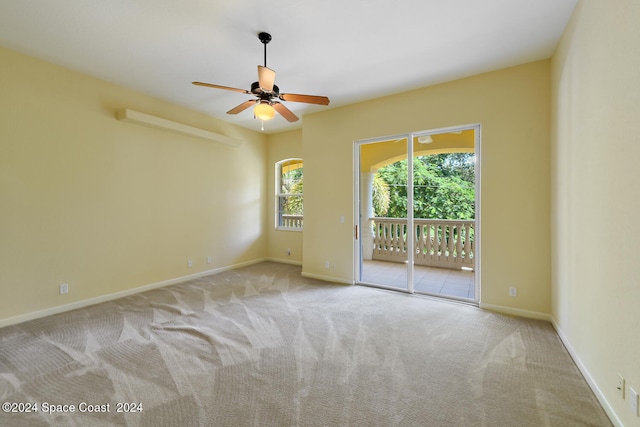 unfurnished room featuring ceiling fan and light colored carpet