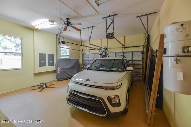 garage featuring a garage door opener, ceiling fan, and electric panel