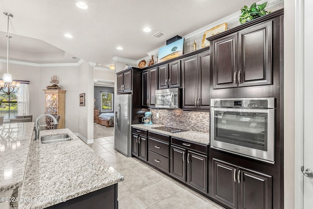 kitchen featuring sink, stainless steel appliances, decorative light fixtures, crown molding, and light tile patterned floors