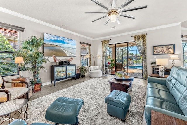 living room with crown molding, light tile patterned flooring, a textured ceiling, and ceiling fan