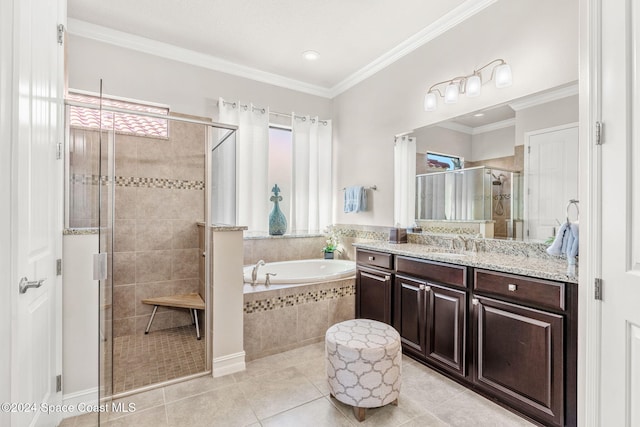 bathroom featuring vanity, crown molding, shower with separate bathtub, and tile patterned flooring