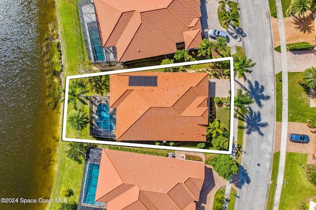 birds eye view of property featuring a water view