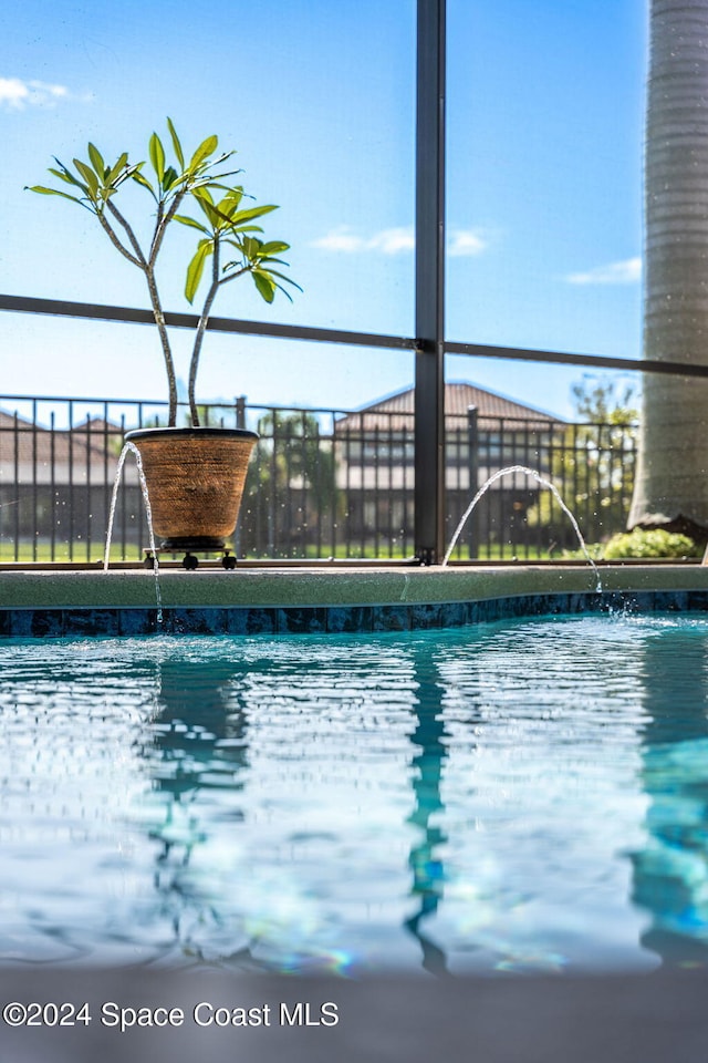 view of pool with pool water feature