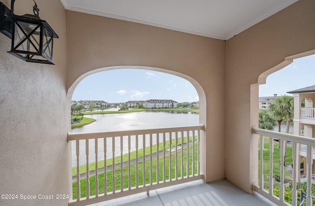 balcony featuring a water view