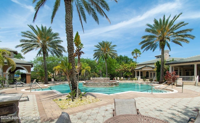 view of swimming pool featuring a patio area