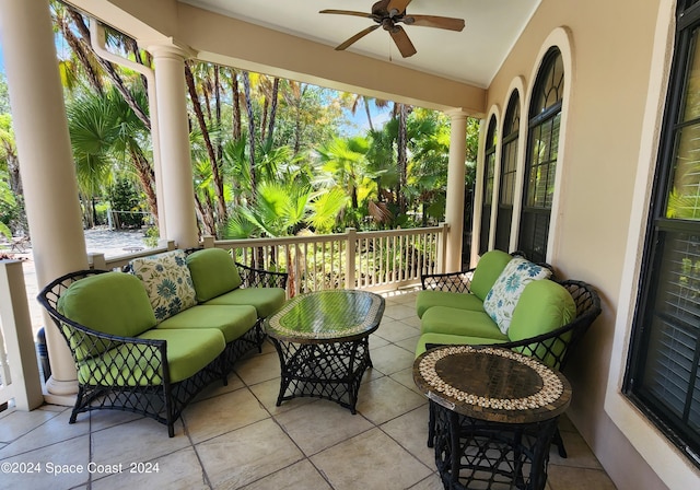 view of patio with ceiling fan and an outdoor living space