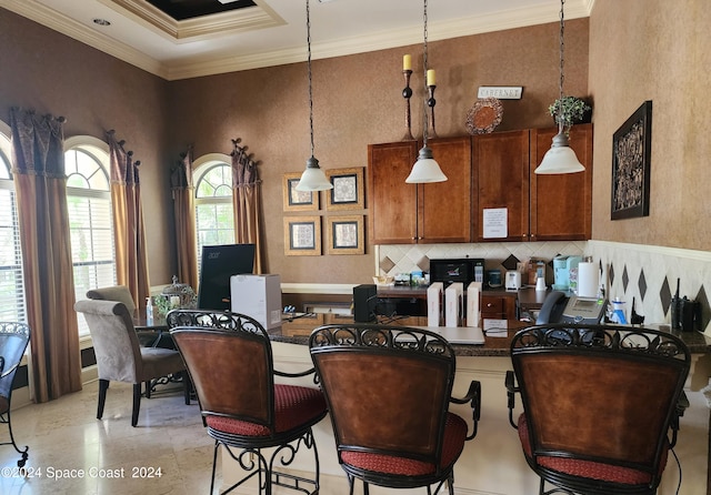 dining space with crown molding