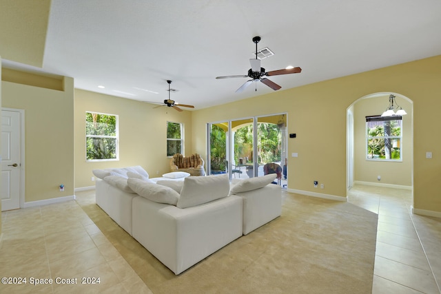 8053 S Indian River Dr, Ft Pierce, FL 34982 - living area with light tile patterned flooring, plenty of natural light, arched walkways, and recessed lighting