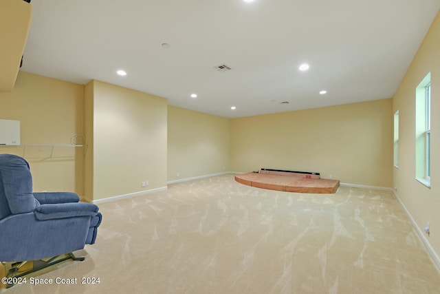 8053 S Indian River Dr, Ft Pierce, FL 34982 - unfurnished room featuring light carpet, recessed lighting, baseboards, and baseboard heating