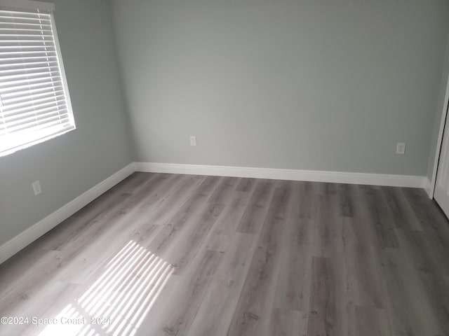 unfurnished room featuring hardwood / wood-style floors