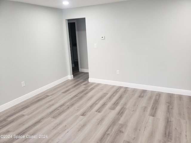 spare room with light hardwood / wood-style floors