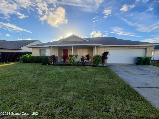 single story home with a front lawn and a garage