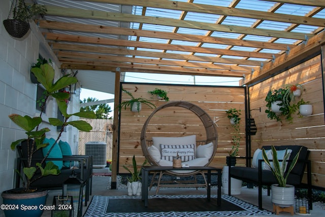 view of patio with cooling unit and a pergola