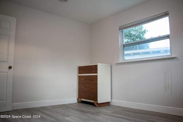 unfurnished bedroom with light wood-type flooring