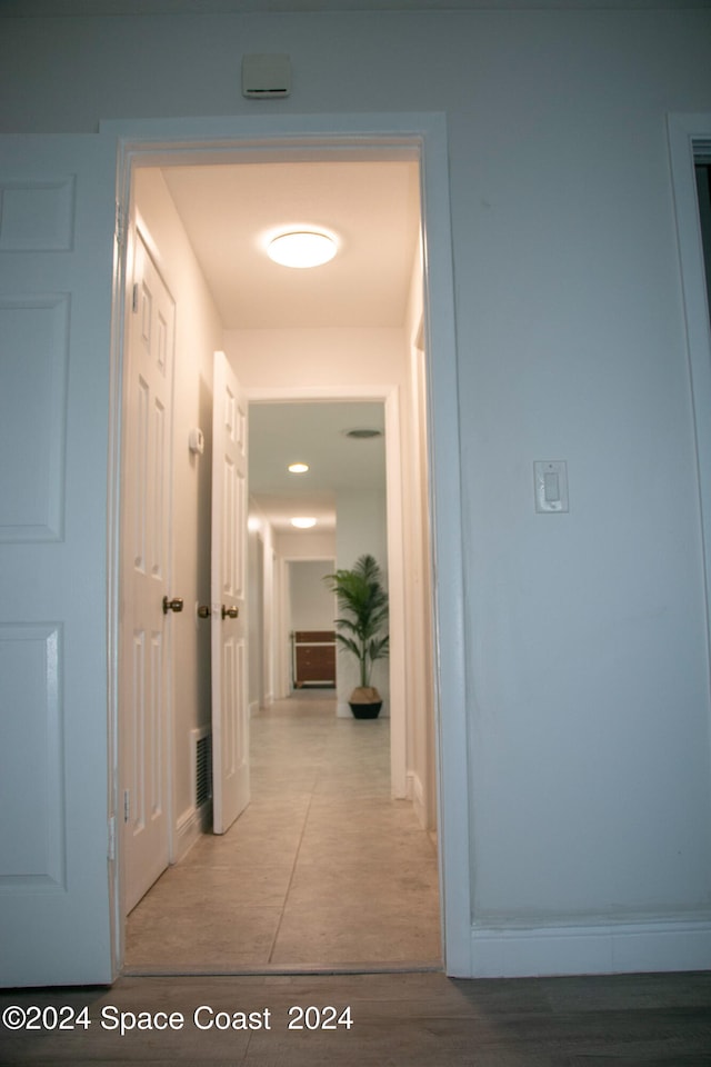 hallway with light wood-type flooring