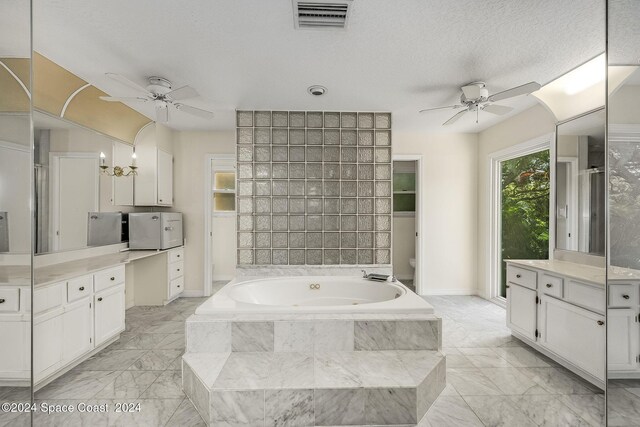 1165 Old Parsonage Dr, Merritt Island, FL 32952 - bathroom featuring a ceiling fan, marble finish flooring, a bath, and vanity