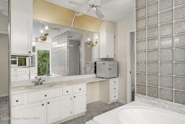 1165 Old Parsonage Dr, Merritt Island, FL 32952 - full bath with a ceiling fan, vanity, toilet, and a walk in shower