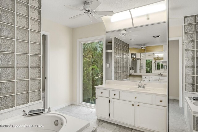 1165 Old Parsonage Dr, Merritt Island, FL 32952 - full bath featuring a ceiling fan, a bath, vanity, and marble finish floors
