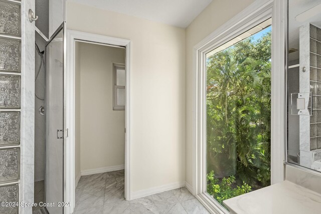 1165 Old Parsonage Dr, Merritt Island, FL 32952 - bathroom featuring marble finish floors and baseboards