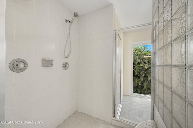 bathroom with tiled shower