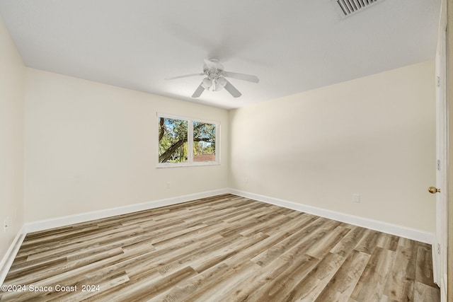 unfurnished room with ceiling fan and light wood-type flooring