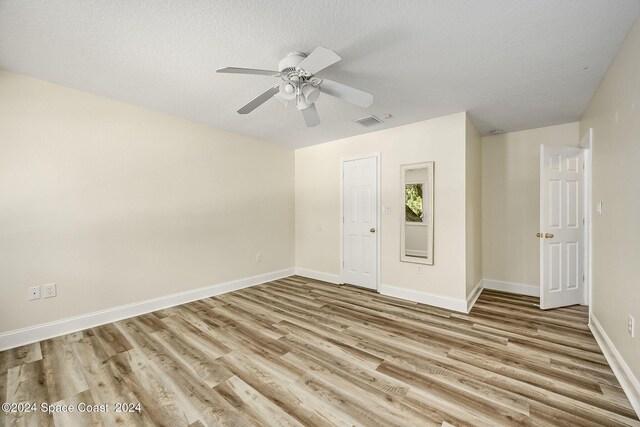 1165 Old Parsonage Dr, Merritt Island, FL 32952 - unfurnished room with wood finished floors, baseboards, and a ceiling fan