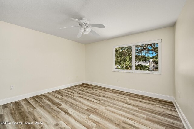 1165 Old Parsonage Dr, Merritt Island, FL 32952 - spare room featuring wood finished floors, ceiling fan, and baseboards