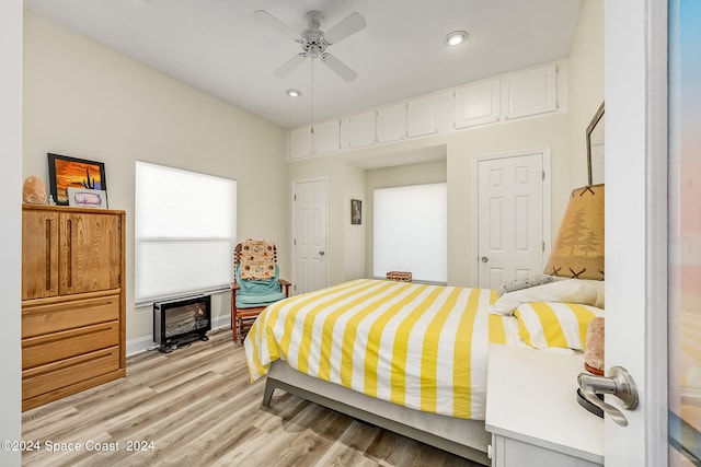 bedroom featuring light wood-type flooring and ceiling fan