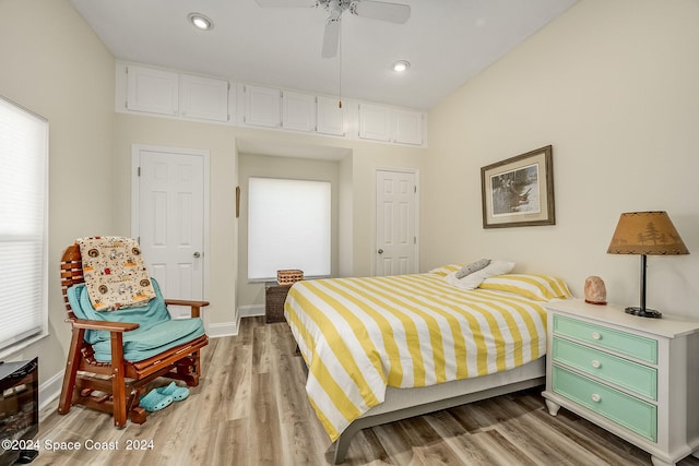 bedroom with ceiling fan and light hardwood / wood-style floors