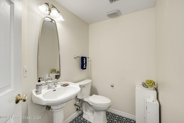1165 Old Parsonage Dr, Merritt Island, FL 32952 - bathroom with baseboards and toilet