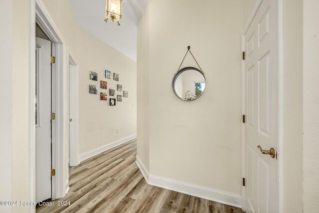 1165 Old Parsonage Dr, Merritt Island, FL 32952 - hallway featuring wood finished floors and baseboards