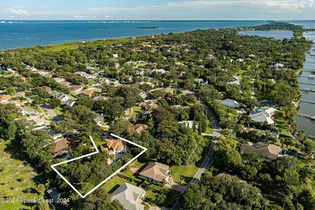1165 Old Parsonage Dr, Merritt Island, FL 32952 - aerial perspective of suburban area featuring property boundaries highlighted and a large body of water