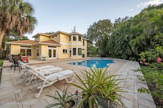1165 Old Parsonage Dr, Merritt Island, FL 32952 - view of swimming pool with french doors and a patio area