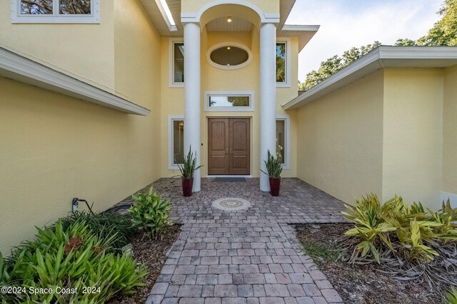 1165 Old Parsonage Dr, Merritt Island, FL 32952 - property entrance featuring stucco siding