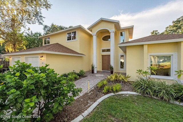 1165 Old Parsonage Dr, Merritt Island, FL 32952 - view of front of house featuring stucco siding and roof with shingles