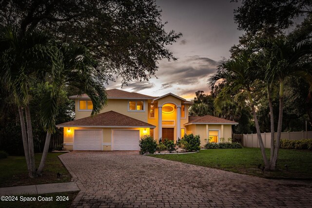 1165 Old Parsonage Dr, Merritt Island, FL 32952 - view of front facade with an attached garage, driveway, and stucco siding