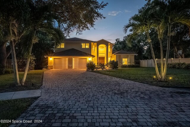 1165 Old Parsonage Dr, Merritt Island, FL 32952 - traditional-style house featuring decorative driveway, a garage, and stucco siding