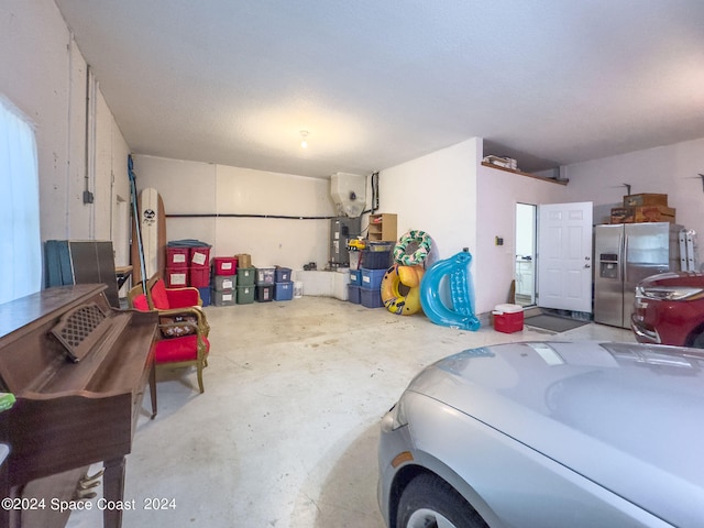 garage featuring stainless steel fridge with ice dispenser and secured water heater