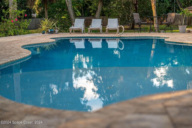 1165 Old Parsonage Dr, Merritt Island, FL 32952 - view of swimming pool with fence and a patio area