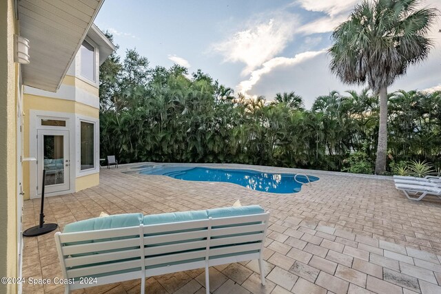 1165 Old Parsonage Dr, Merritt Island, FL 32952 - swimming pool with a patio area and an outdoor hangout area