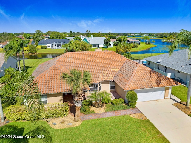 birds eye view of property featuring a water view