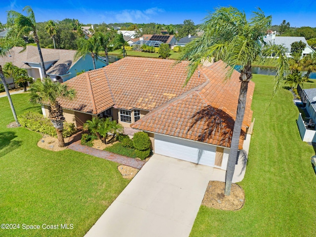 birds eye view of property featuring a water view