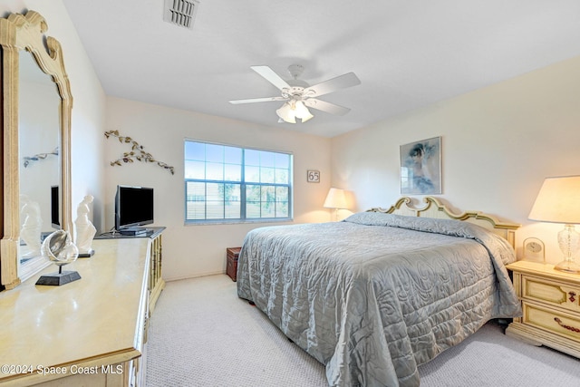 bedroom featuring light colored carpet and ceiling fan