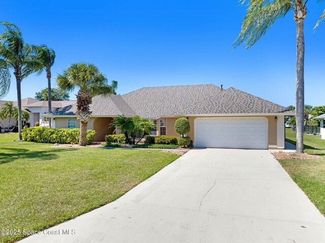 818 Spanish Wells Dr, Melbourne, FL 32940 - single story home with stucco siding, an attached garage, concrete driveway, and a front lawn