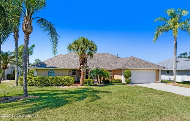 818 Spanish Wells Dr, Melbourne, FL 32940 - ranch-style home with an attached garage, concrete driveway, a front lawn, and stucco siding