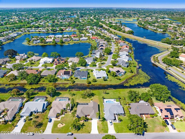 818 Spanish Wells Dr, Melbourne, FL 32940 - drone / aerial view featuring a residential view and a water view