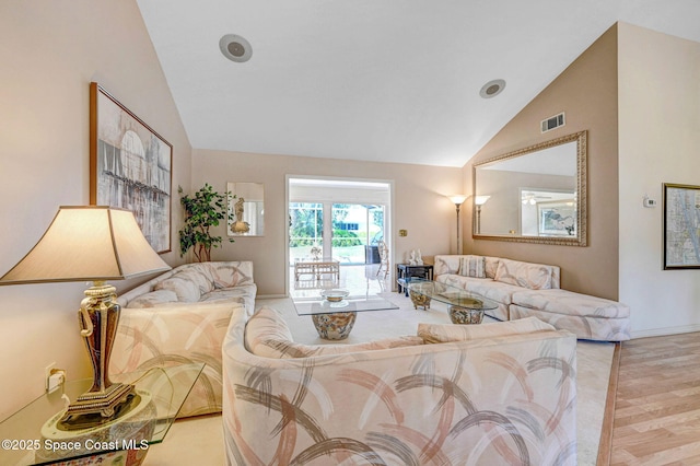 818 Spanish Wells Dr, Melbourne, FL 32940 - living area with high vaulted ceiling, wood finished floors, and visible vents